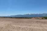 Mountain views and a spacious lot await in this stunning location.
