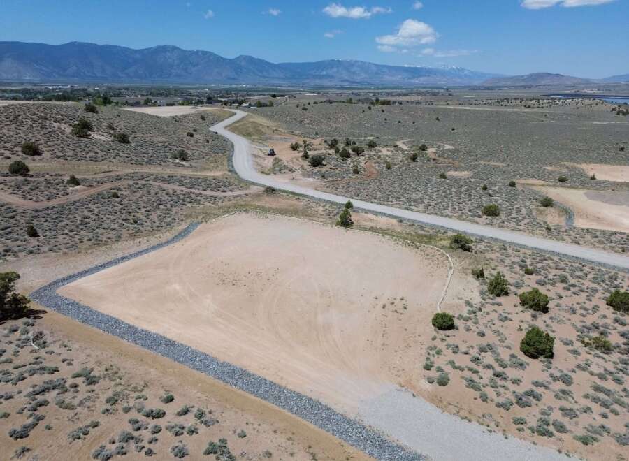 This property boasts stunning mountain views and a spacious, level lot perfect for building your dream home.
