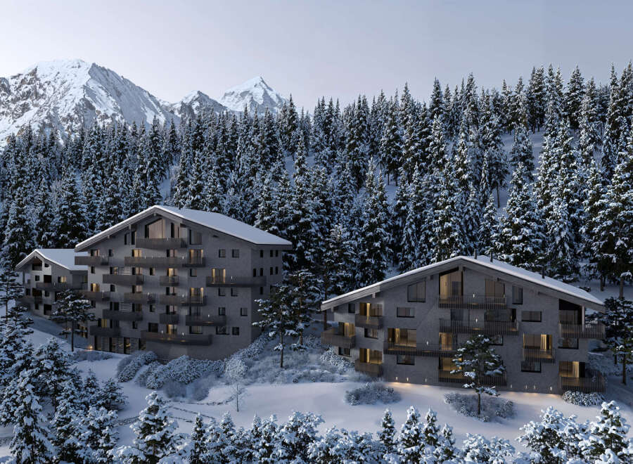 Luxury chalet apartments nestled in a snowy mountainside forest.