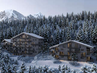 Luxury chalet apartments nestled in a snowy mountainside forest.