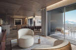 Luxury chalet apartment boasting stunning mountain views and a spacious open-plan living area.
