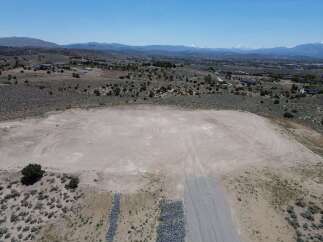 This undeveloped lot boasts a spacious, level building pad, perfect for your dream home.