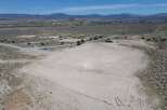 This property boasts a large, flat, and undeveloped area perfect for various uses.