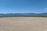 This expansive property boasts breathtaking views of the snow-capped mountains.