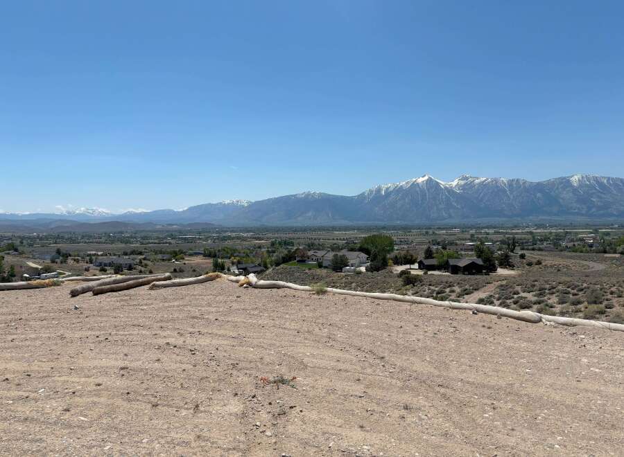 Mountain views and a spacious lot await in this stunning property.