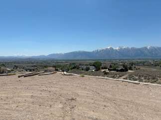 Mountain views and a spacious lot await in this stunning property.