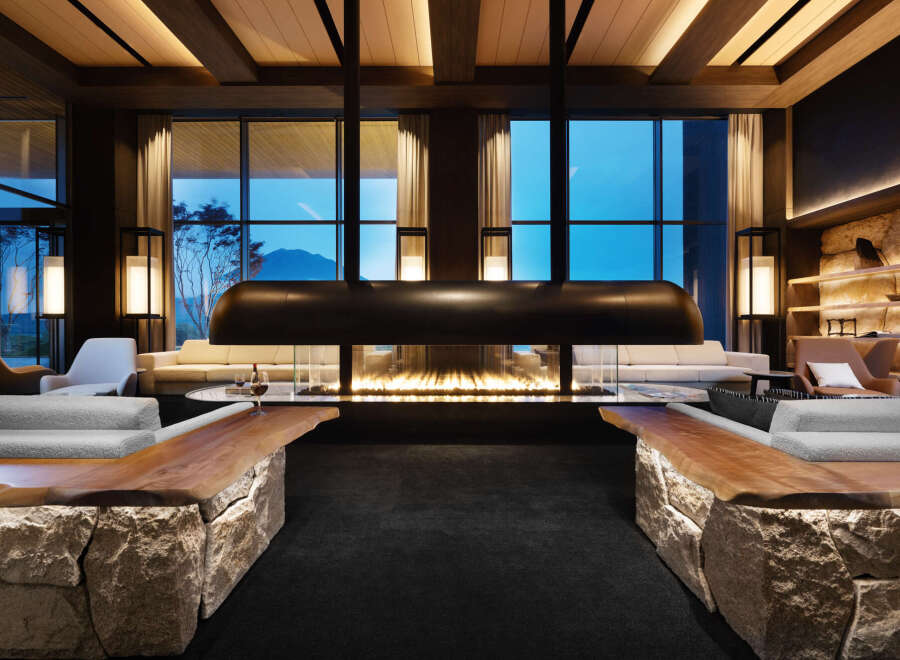 Luxurious lodge with floor-to-ceiling windows offering breathtaking mountain views.