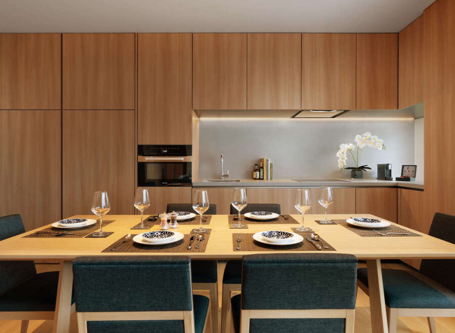 This stunning apartment boasts a modern kitchen with sleek wooden cabinetry and integrated appliances.