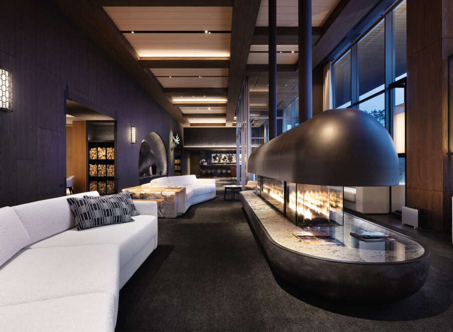 Luxury hotel lobby with a stunning fireplace as the centerpiece.