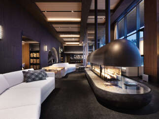 Luxury hotel lobby with a stunning fireplace as the centerpiece.