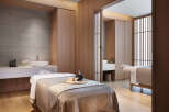 Indulge in tranquility at our luxurious spa, featuring serene private treatment rooms with plush massage tables and modern amenities.