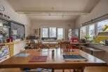 Cozy and eclectic lodge with a large communal table perfect for gatherings.