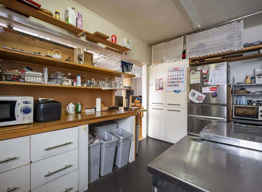 Fully equipped kitchen with ample storage.