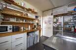 Fully equipped kitchen with ample storage.
