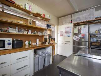 Fully equipped kitchen with ample storage.