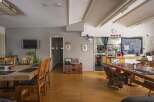 This charming hostel boasts a spacious communal area with multiple dining tables, perfect for socializing with fellow travelers.