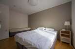 Bright and airy bedroom with two beds, perfect for guests or roommates.