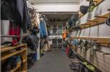 This spacious ski storage room offers ample storage for all your winter gear.