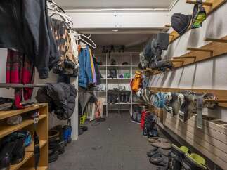 This spacious ski storage room offers ample storage for all your winter gear.
