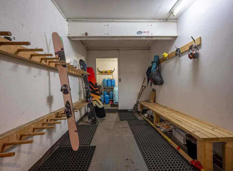 This spacious ski room offers ample storage for all your winter gear.