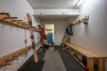 This spacious ski room offers ample storage for all your winter gear.