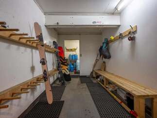 This spacious ski room offers ample storage for all your winter gear.