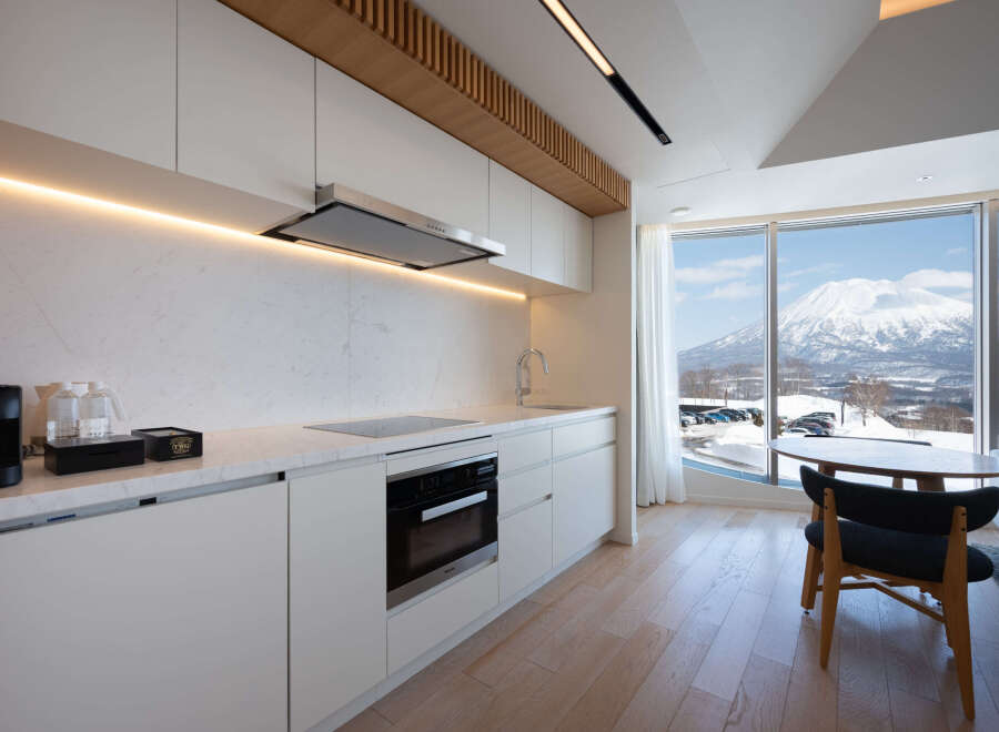Luxury condo with breathtaking mountain views and modern kitchen.
