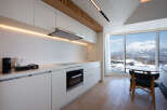Luxury condo with breathtaking mountain views and modern kitchen.
