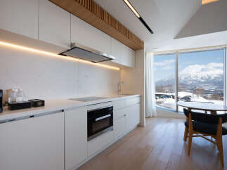 Luxury condo with breathtaking mountain views and modern kitchen.