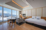 Wake up to breathtaking mountain views from this luxurious hotel room.