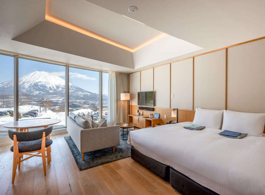 Wake up to breathtaking views of snow-capped mountains from this luxurious hotel room.