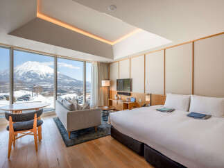 Wake up to breathtaking views of snow-capped mountains from this luxurious hotel room.