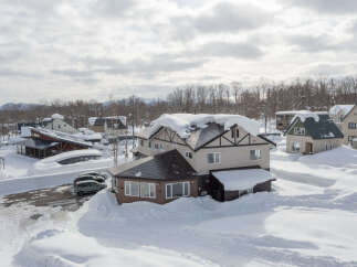 This stunning property boasts a prime location in a snow-covered winter wonderland.