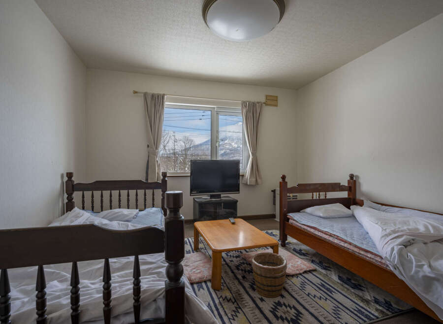 Cozy twin bedroom with mountain views.