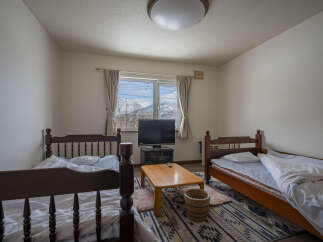 Cozy twin bedroom with mountain views.