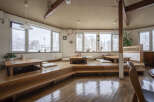 Cozy Japanese-style restaurant with tatami seating and wooden floors.