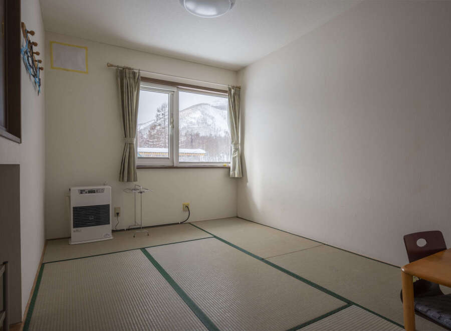 Cozy room with tatami mats, offering a serene atmosphere.