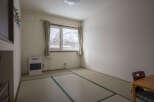 Cozy room with tatami mats, offering a serene atmosphere.