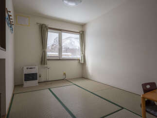 Cozy room with tatami mats, offering a serene atmosphere.