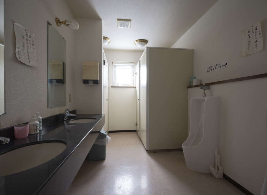 This well-maintained restroom features modern sinks and toilets, ensuring a comfortable and clean experience.