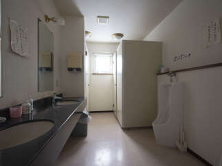 This well-maintained restroom features modern sinks and toilets, ensuring a comfortable and clean experience.