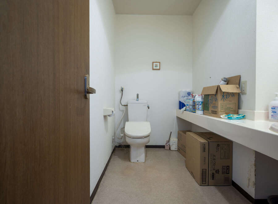 This property features a clean and functional bathroom with a toilet and sink.