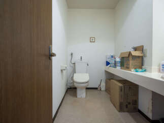 This property features a clean and functional bathroom with a toilet and sink.