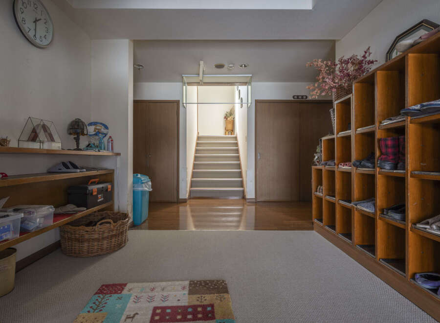 This charming home features a spacious entryway with ample storage, perfect for keeping shoes and other items organized.