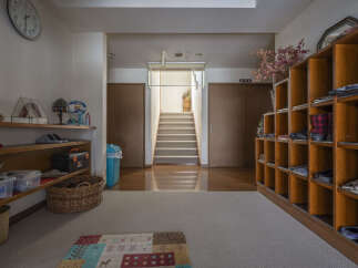 This charming home features a spacious entryway with ample storage, perfect for keeping shoes and other items organized.