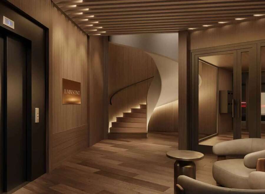 Experience luxurious living in this stunning building, featuring a sleek elevator, a modern curved staircase, and a sophisticated lobby.