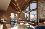 Luxury chalet with stunning mountain views and spacious living area.