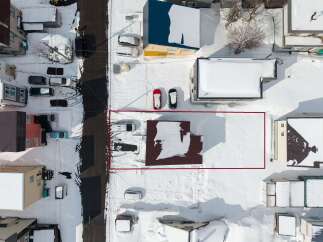 This snow-covered lot is perfect for building your dream home.