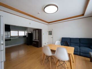 This cozy apartment boasts a modern kitchen with sleek gray cabinets and stainless steel appliances.