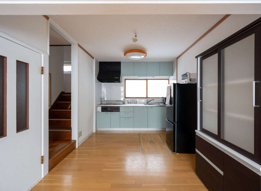 This charming home features a light and airy kitchen with modern appliances and ample cabinet space.